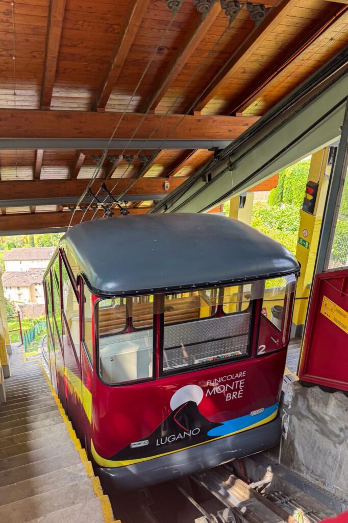 Red Monte Brè funicular car in Suvigliana station, Lugano