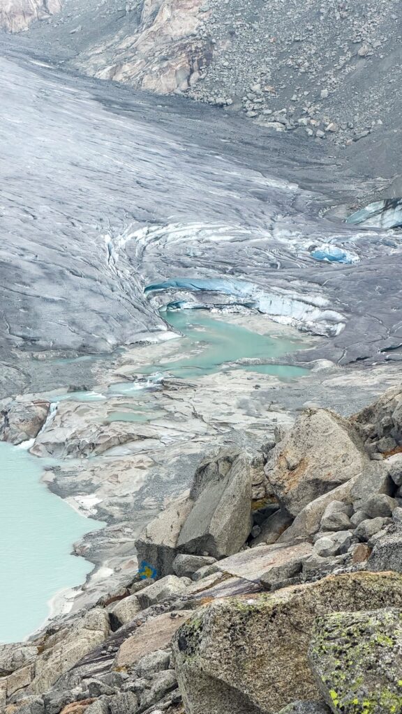 Snout of the Rhône Glacier from above, with meltwater pools